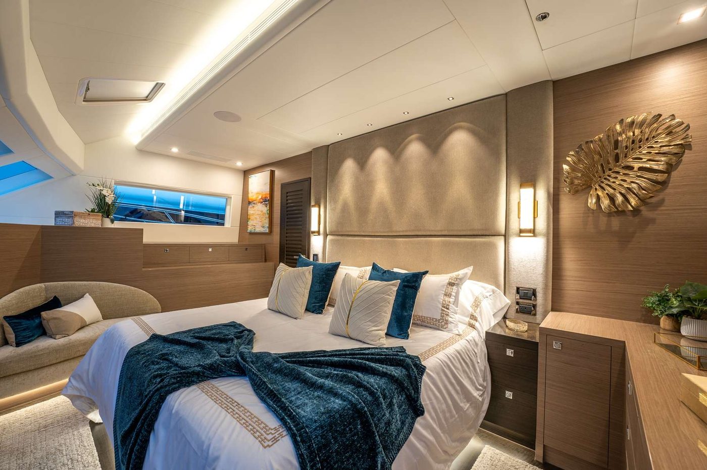 The deck-level primary King cabin with ensuite and lounge seating